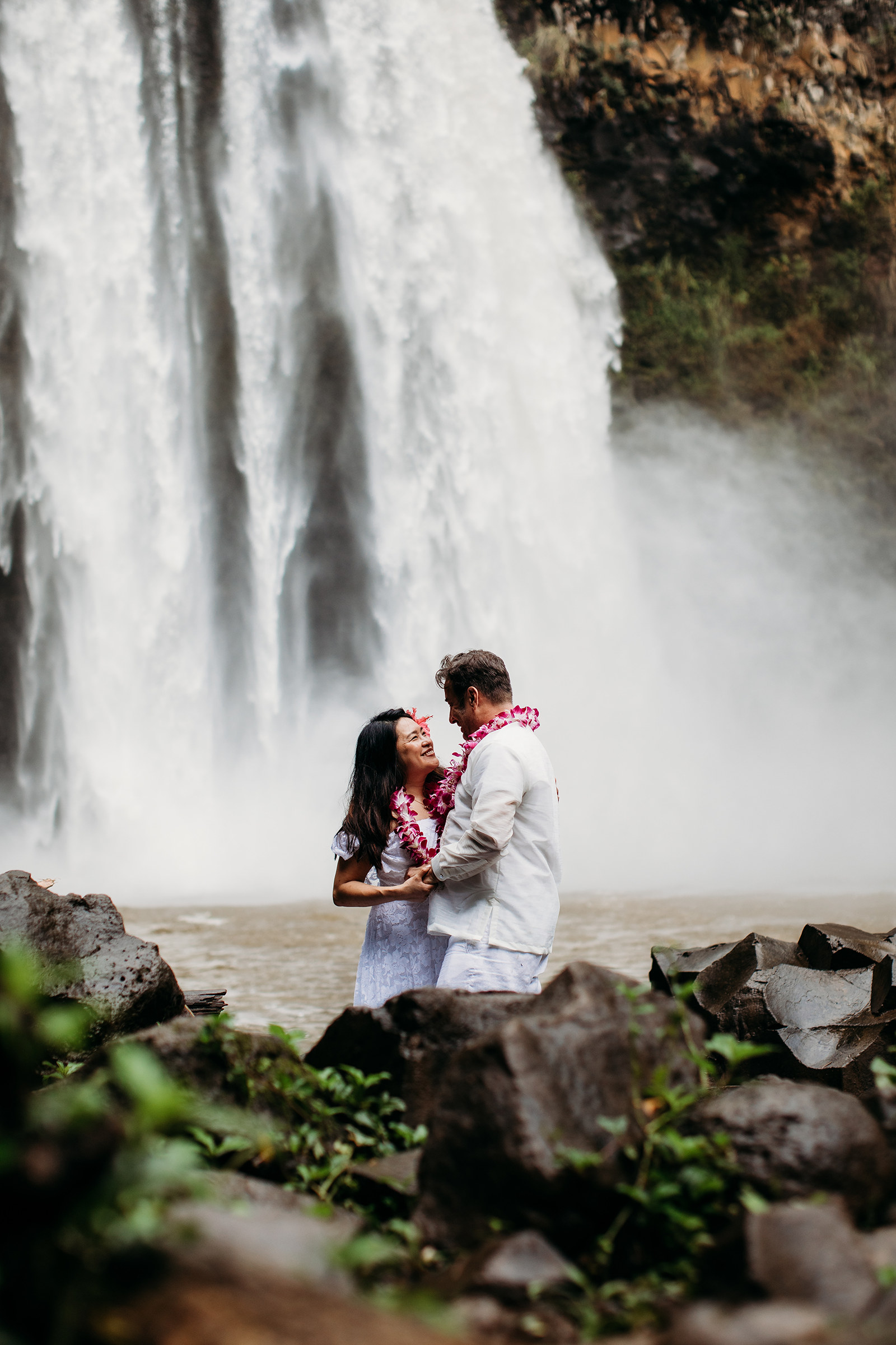 Hawaiian Bride and Groom in front of a Waterfall